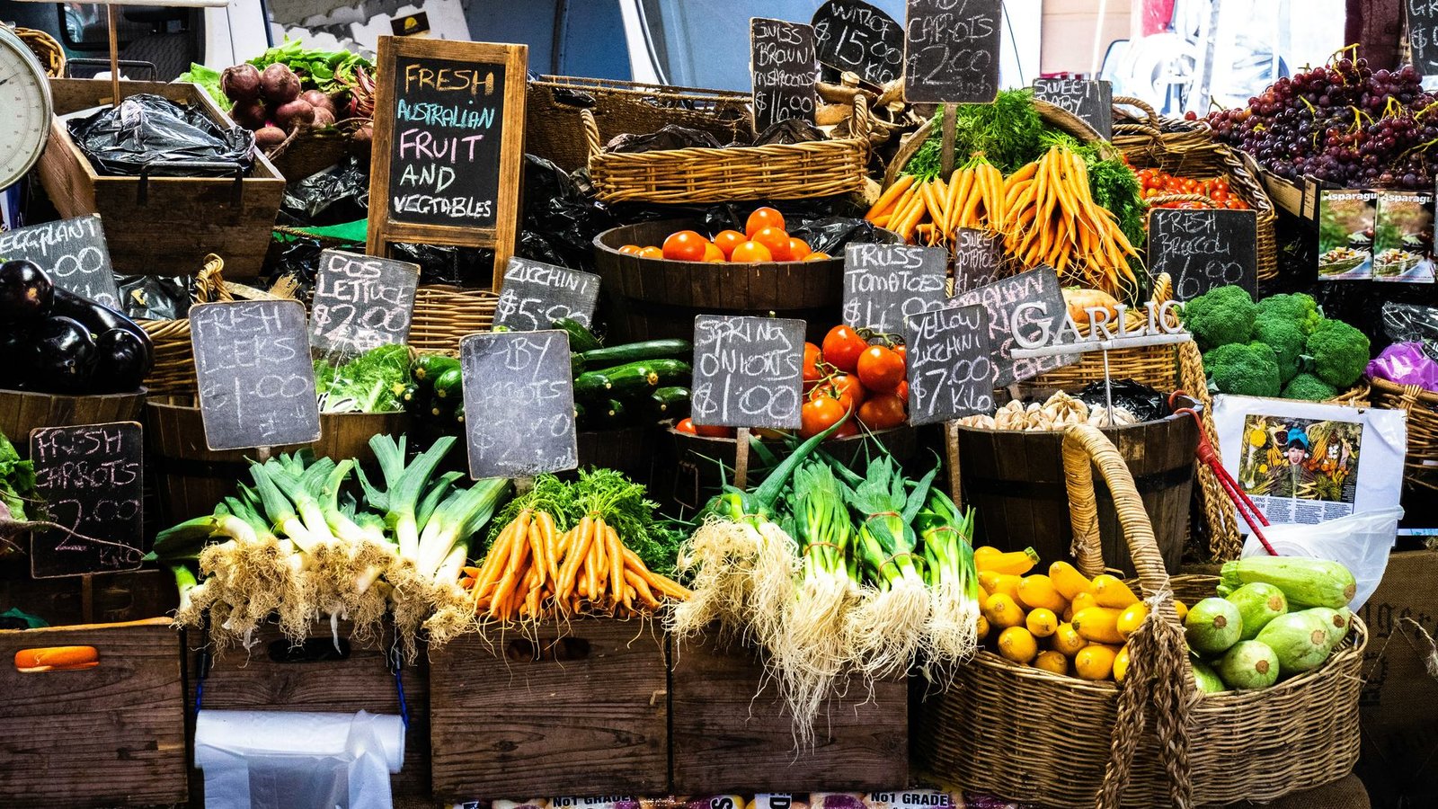 A market stall stacked with fresh produce